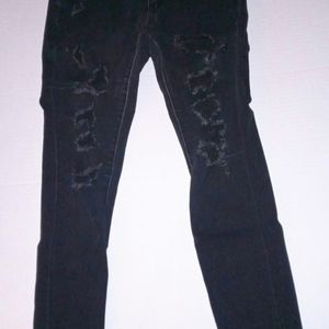 American Eagle Womens. Low rise Black skinny jeans, distressed as f.